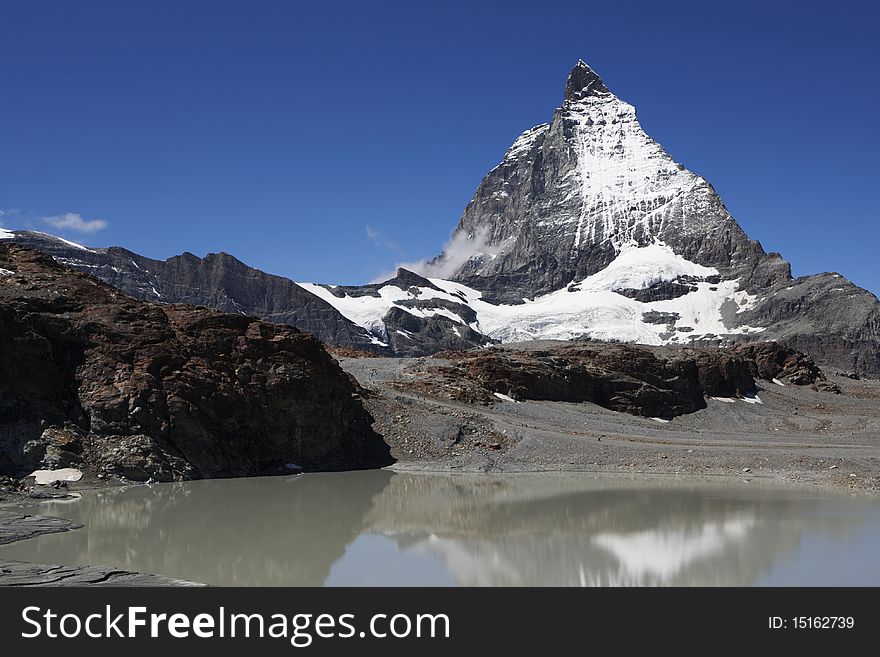 The symbol of the Alps - the Matterhorn, one of the lakes below.