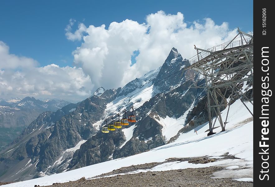 The peak of Grand Pic La Meije in the French Alps with the cablecars in front of it. The peak of Grand Pic La Meije in the French Alps with the cablecars in front of it