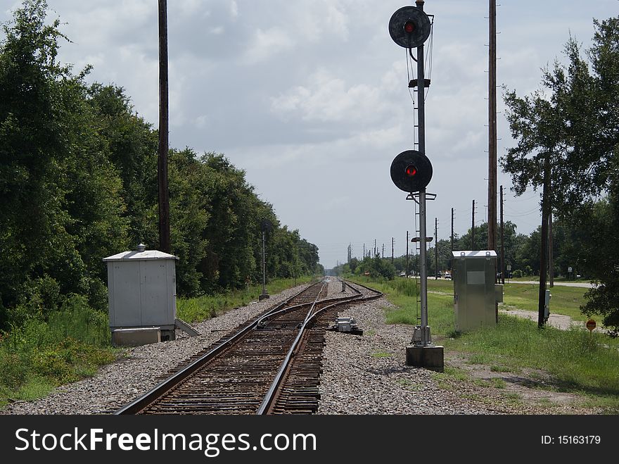 Rail spur with equipment cabinets and signal lights