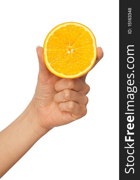 Slice of a fresh Sicilian orange in the hand