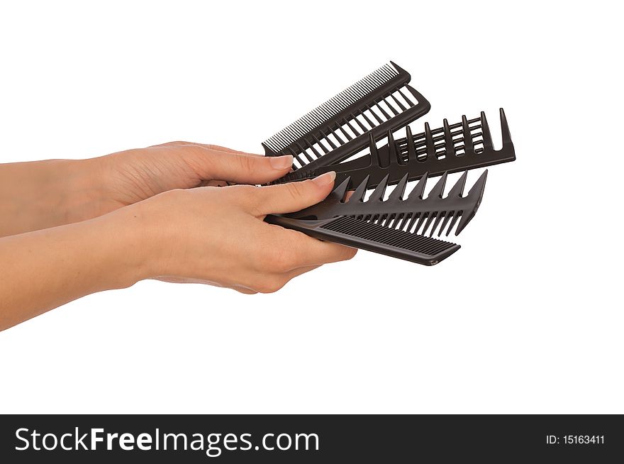 Hairdresser holds the black tools for haircut