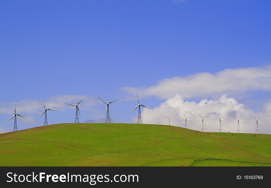 Vibrant landscape of windmills atop the rolling hills of Northern California. Vibrant landscape of windmills atop the rolling hills of Northern California.