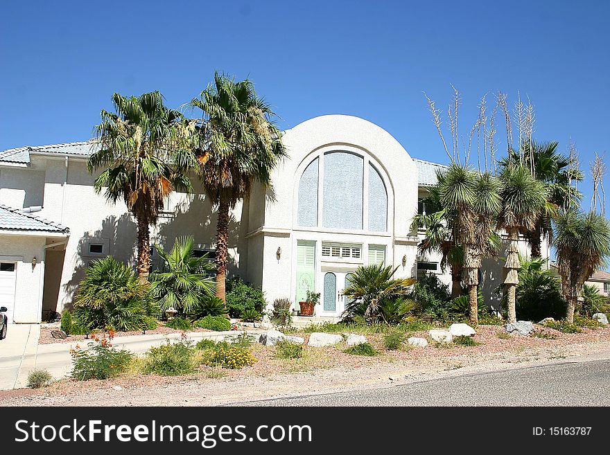 A slanted house the lovely desert landscaping. A slanted house the lovely desert landscaping.