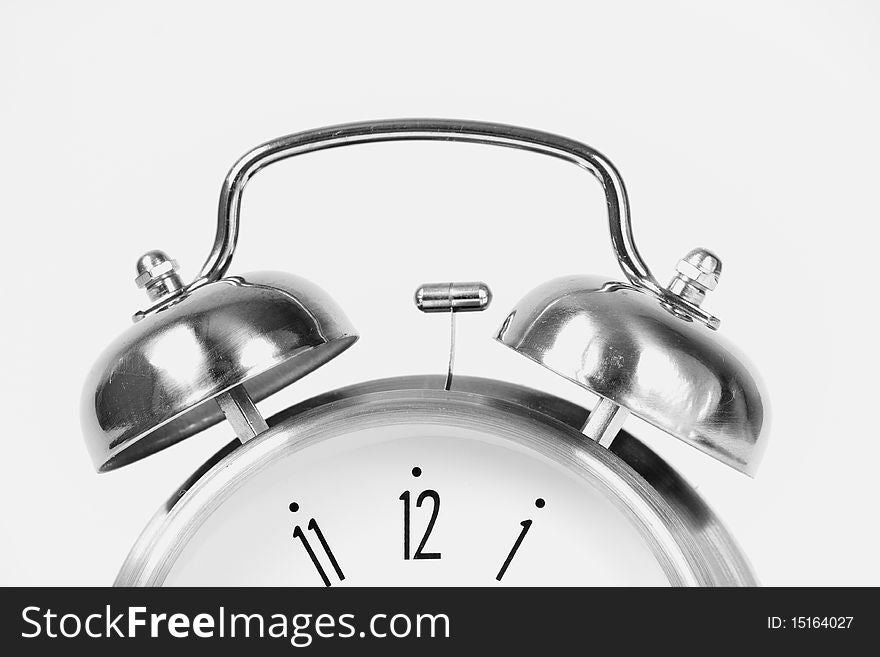 Classical retro ring clock at white background