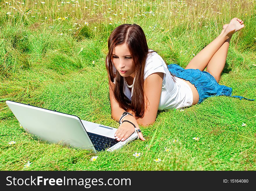 Beauty With Laptop On A Grass.