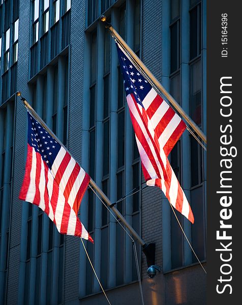 American flags hanging from the side of a building