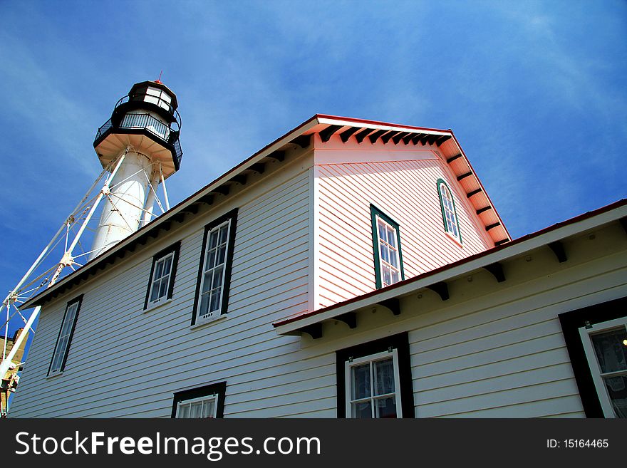 The Whitefish Point Light Station in Michigan on a clear summer day.