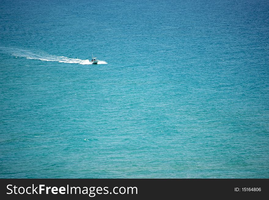 Boat coming towards camera in the middle of the ocean. Boat coming towards camera in the middle of the ocean