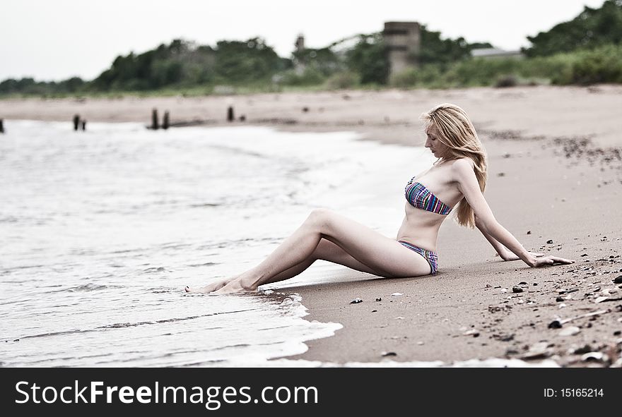 Young beautiful woman  on the beach. Young beautiful woman  on the beach