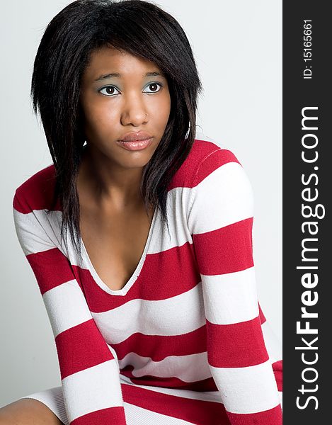 Beatiful young black model posing in striped sweater. Beatiful young black model posing in striped sweater