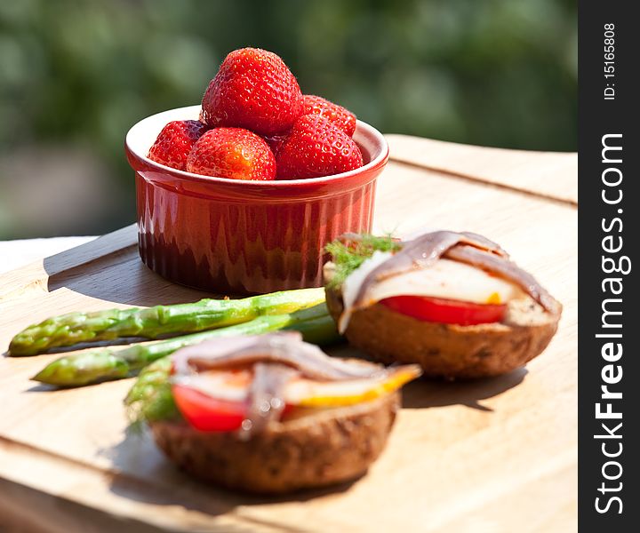 Strawberry and anchovy sandwich and asparagus. Strawberry and anchovy sandwich and asparagus