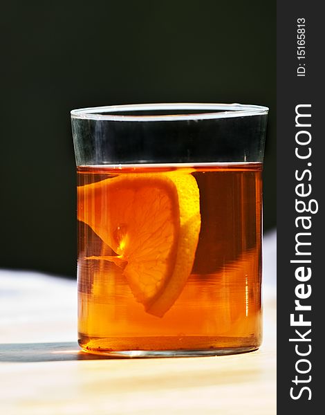 Tea and lemon seagment in glass