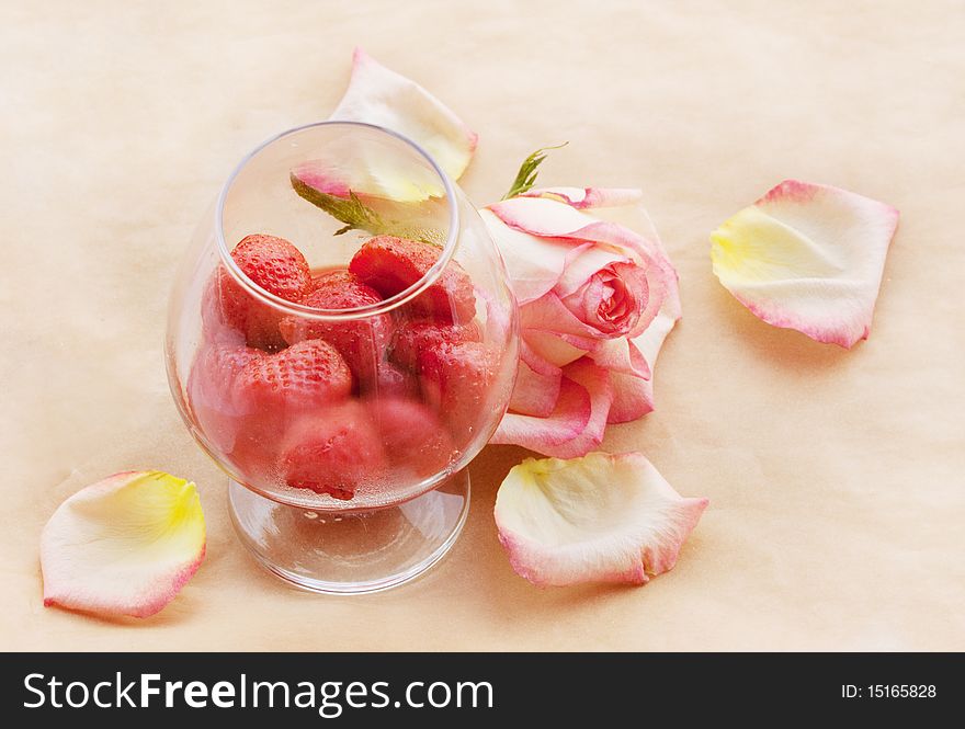 Flaming Strawberry in growing misted glass and ailing rose. Flaming Strawberry in growing misted glass and ailing rose