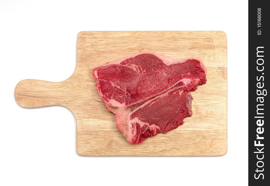 A T Bone steak isolated against a white background. A T Bone steak isolated against a white background