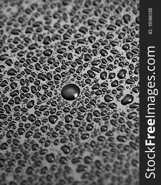 Water droplets isolated on a black surface