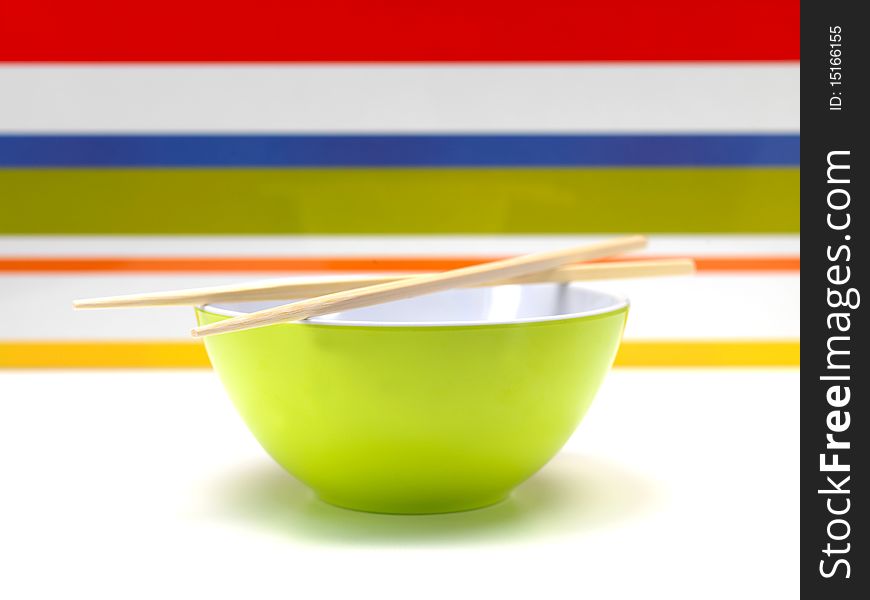 Chop sticks on a noodle bowl on a kitchen bench. Chop sticks on a noodle bowl on a kitchen bench