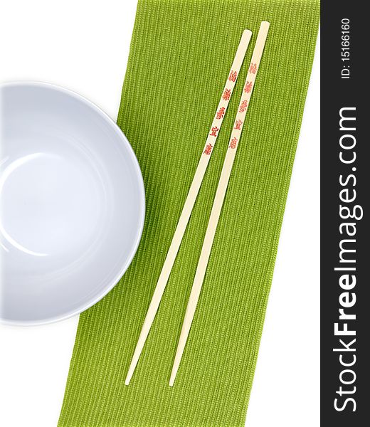 Chop sticks on a noodle bowl on a kitchen bench. Chop sticks on a noodle bowl on a kitchen bench