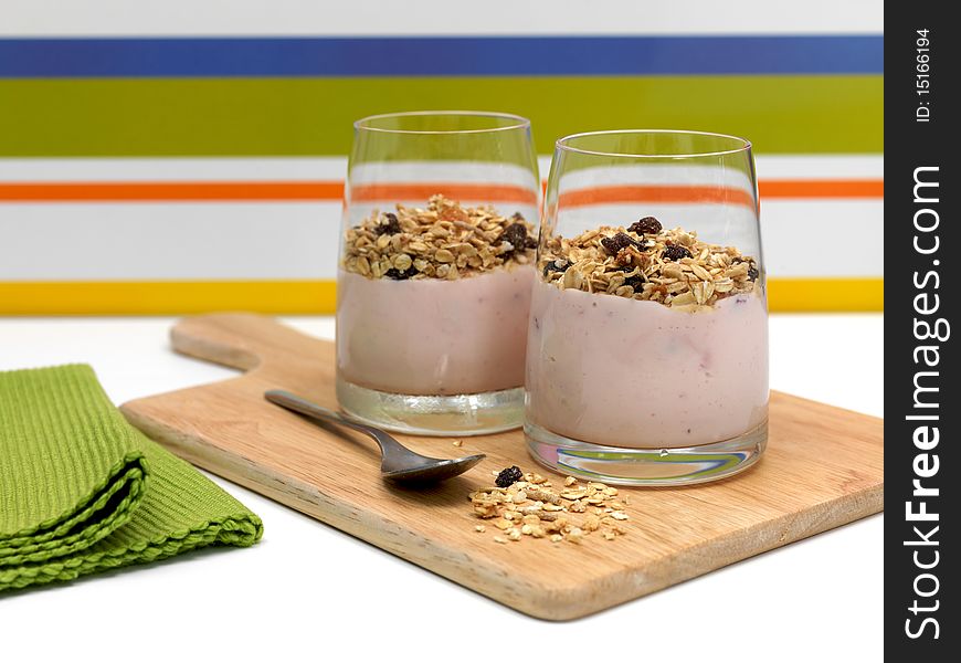 Strawberry yogurt with muesli in a glass. Strawberry yogurt with muesli in a glass