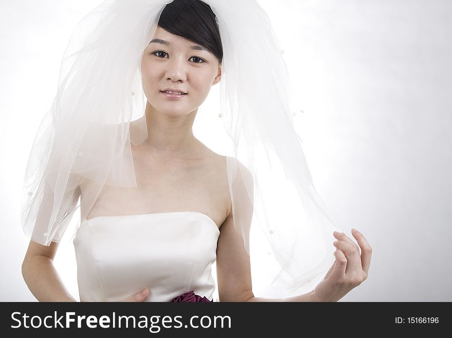 Beautiful bride with perfect natural makeup,smiling,wearing mantilla