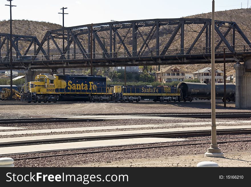 The tracks in front of the recently remodeled Barstow Railroad Station in Barstow, California showing some tank cars and other traffic in the area. The tracks in front of the recently remodeled Barstow Railroad Station in Barstow, California showing some tank cars and other traffic in the area