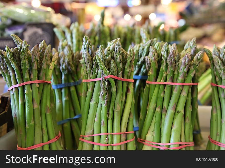 Asparagus bunches in a farmers' market for sale