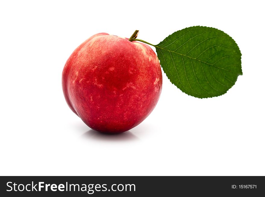 Garden-stuffs juicy ripe nectarine on a white background