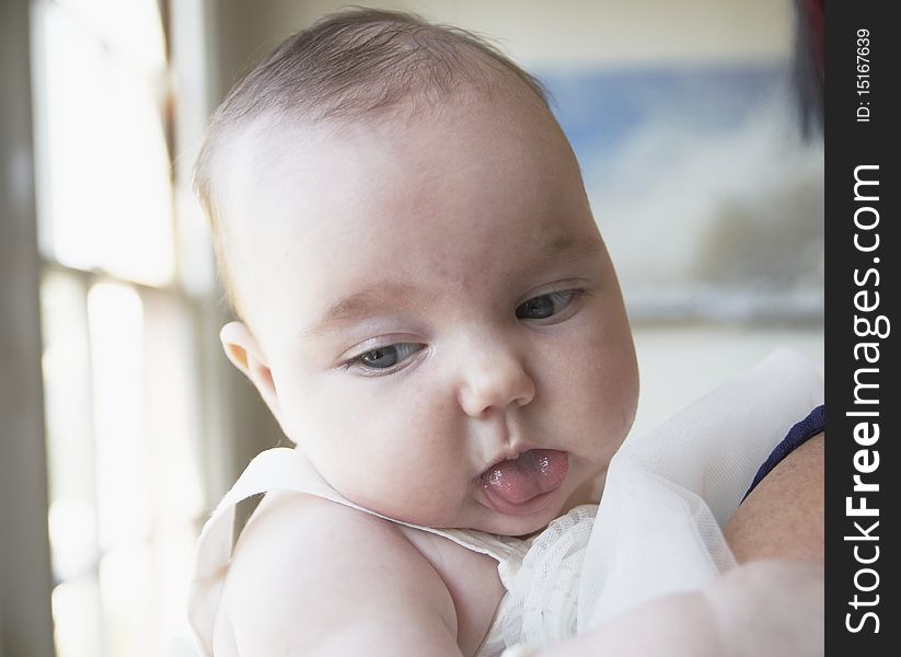 Baby with tongue showing