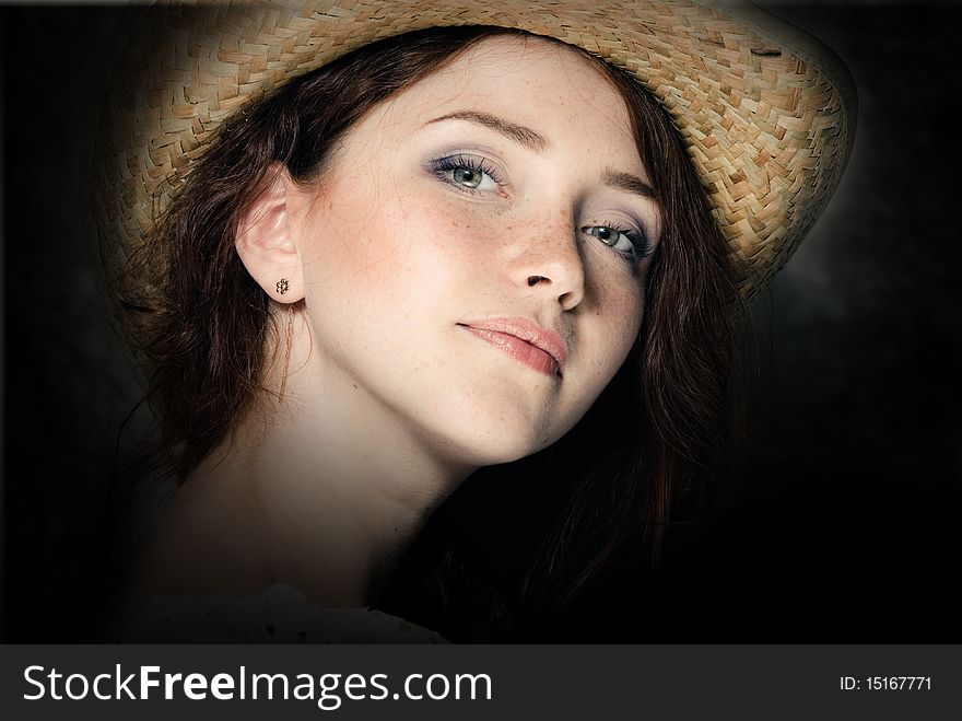 Young woman in a country hat. Young woman in a country hat