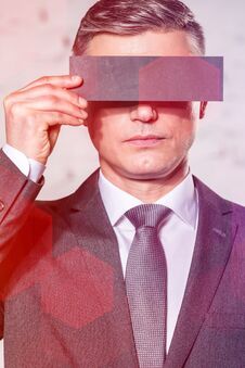 Businessman Covering Eyes With Paper Against Wall At Office Royalty Free Stock Photo Businessman Covering Eyes With Paper Against Wall At Office Royalty Free Stock Photo
