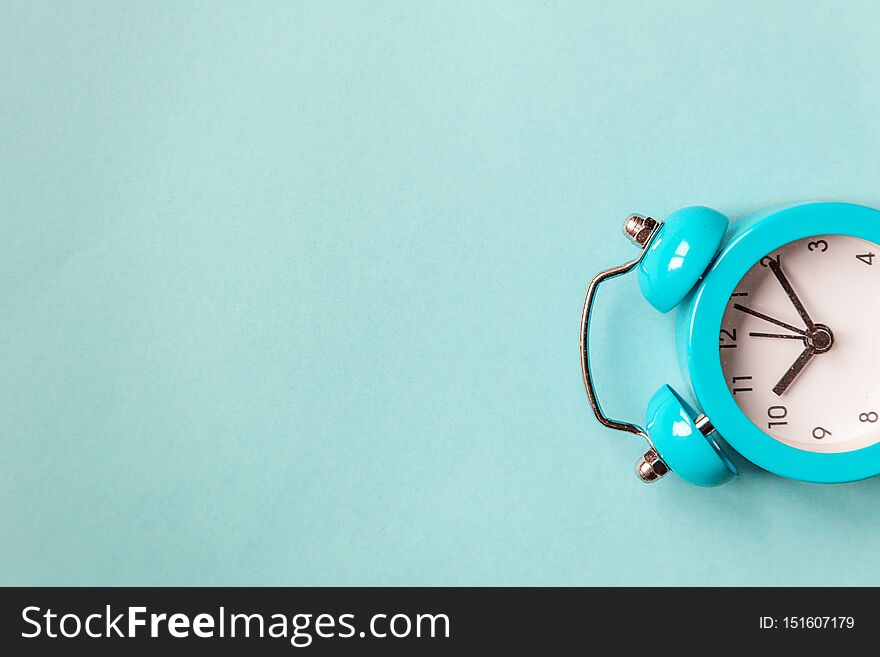 Ringing twin bell vintage classic alarm clock Isolated on blue pastel colorful trendy background. Rest hours time of life good morning night wake up awake concept. Flat lay top view copy space