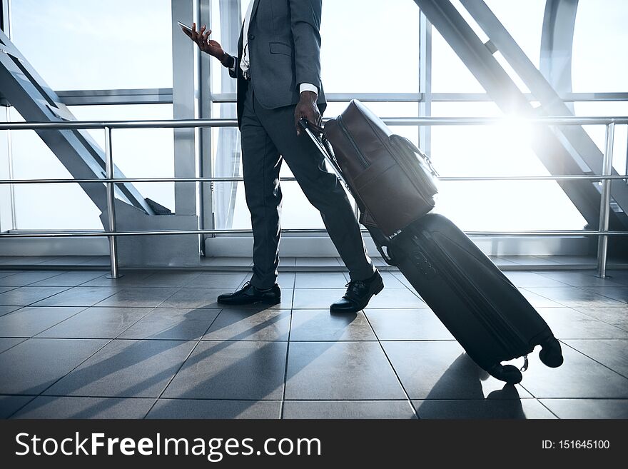 Business Trip. Businessman Moving to Terminal Gate at International Airport