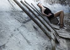 Sexual Girl In Black Dress Inside Stone Quarry Royalty Free Stock Photography