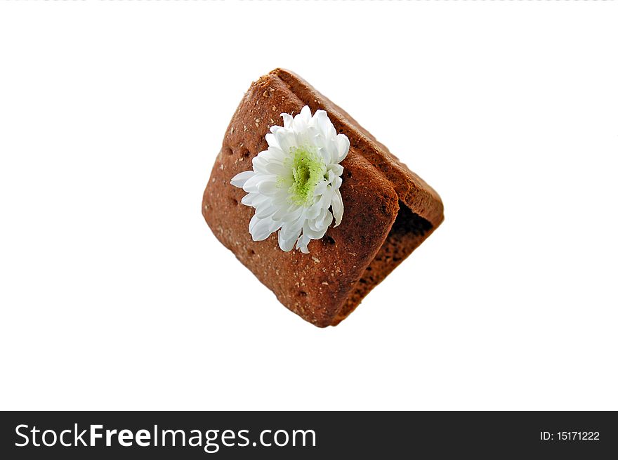 House of slices of black bread and white chrysanthemum flowers instead of a chimney. House of slices of black bread and white chrysanthemum flowers instead of a chimney