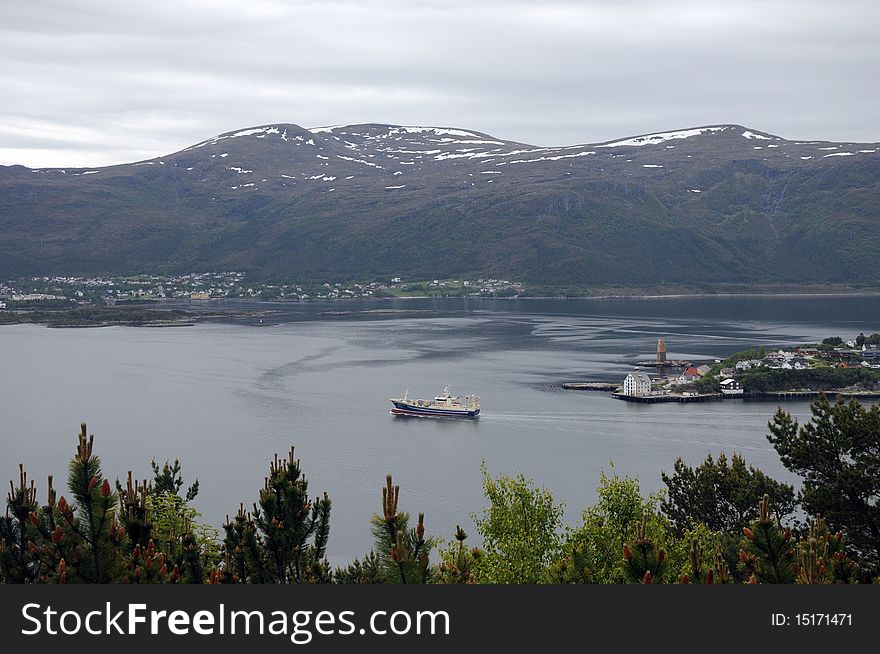 Behind Alesund, the mountainous scenery of the fjord. Behind Alesund, the mountainous scenery of the fjord