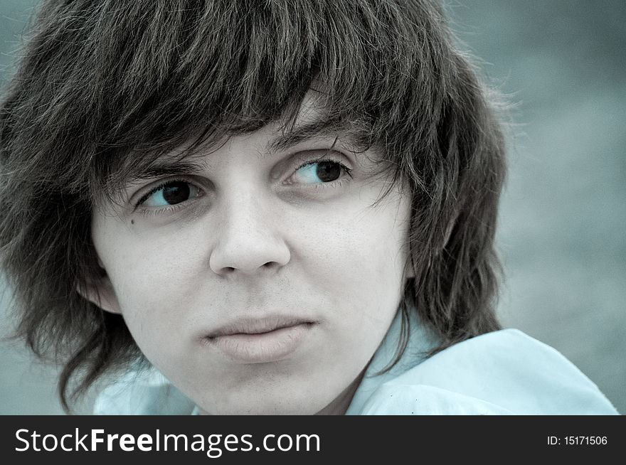 Black and white portrait of a attractive teenager with shaggy hair