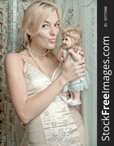 The blonde with a doll