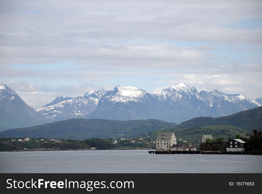 Behind Alesund, the mountainous scenery of the fjord. Behind Alesund, the mountainous scenery of the fjord