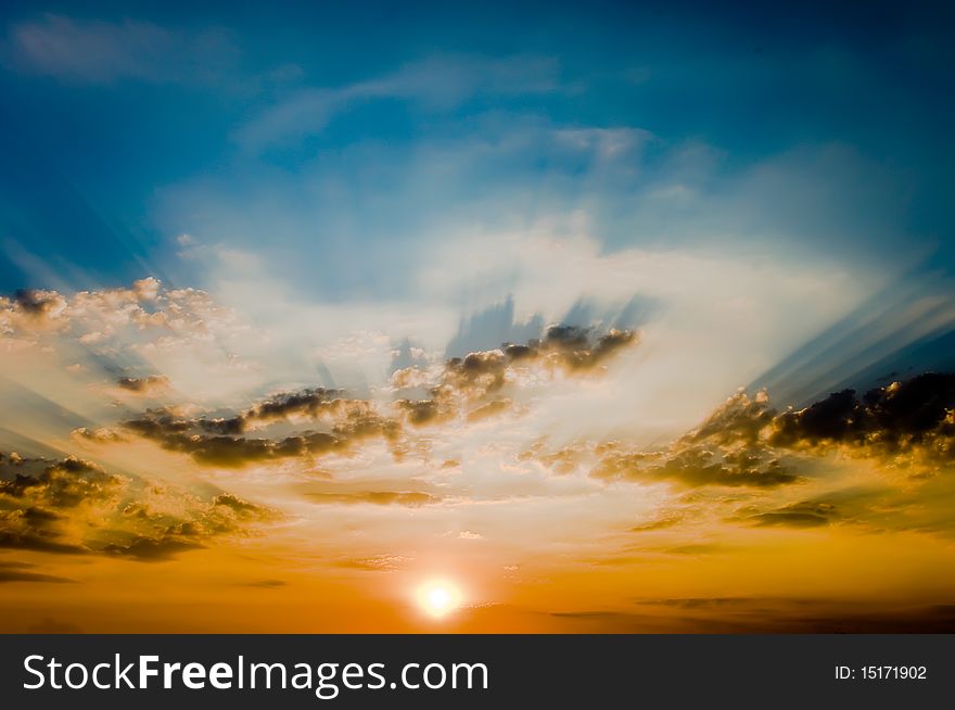 Decline in clouds of the sun with beams background. Decline in clouds of the sun with beams background