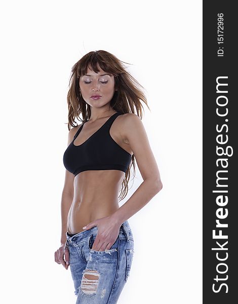 young female in jeans, showing muscle abs. young female in jeans, showing muscle abs