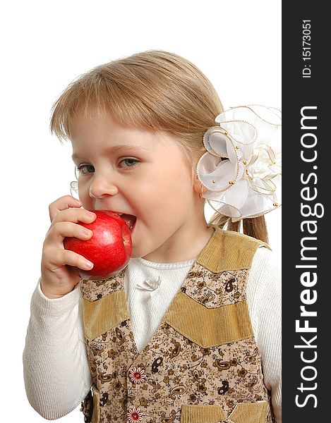 The little girl biting an apple on white