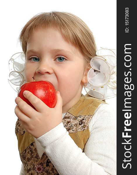 The little girl biting an apple on white