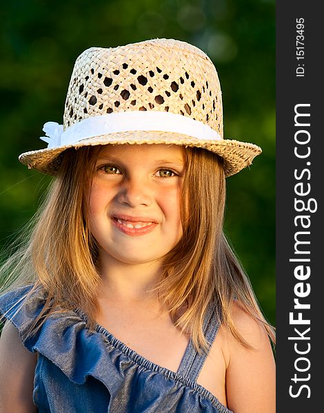 Portrait of beautiful girl in straw hat at the sunshine. Portrait of beautiful girl in straw hat at the sunshine.