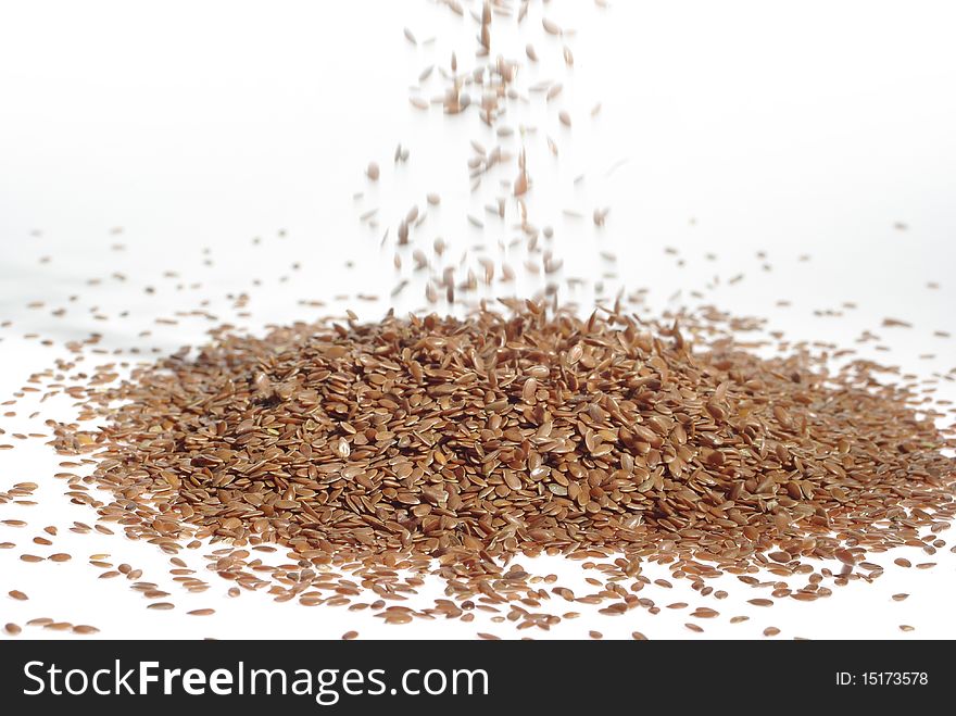 The hill from seeds of flax on white background. The hill from seeds of flax on white background