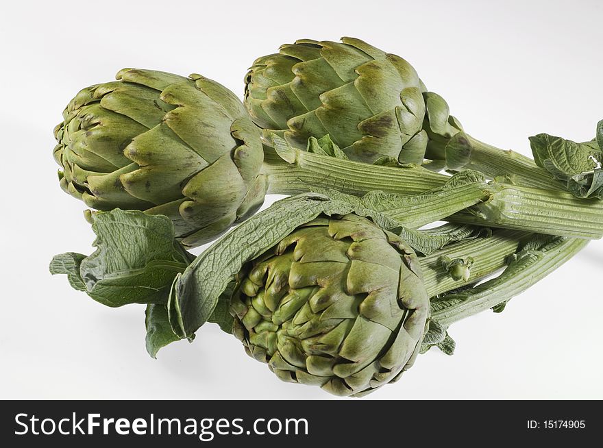 Fresh artichokes isolated on a white background.