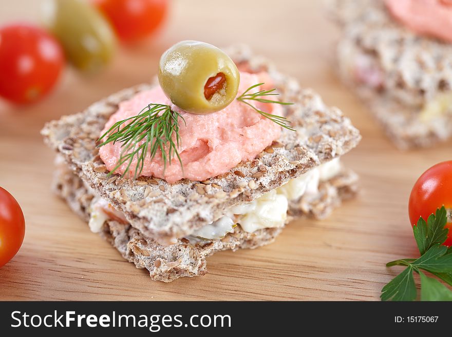 Small sandwich for catering event on wooden table top