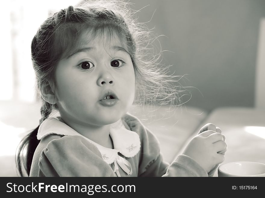 Portrait of pretty little wondering girl with pigtails. Portrait of pretty little wondering girl with pigtails