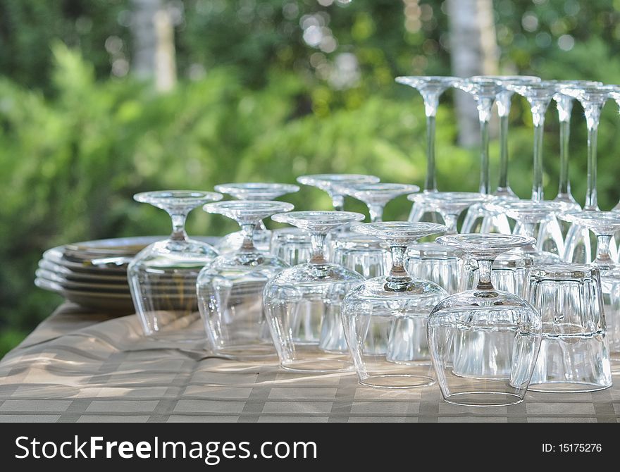 Washed rows of wineglasses on the table in the restaurant