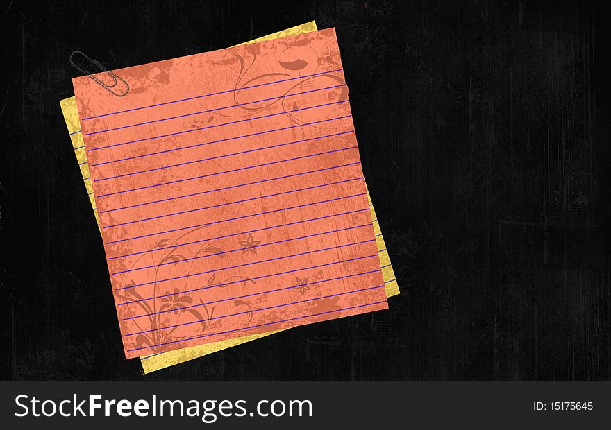 Notepad paper with clip on textured background.