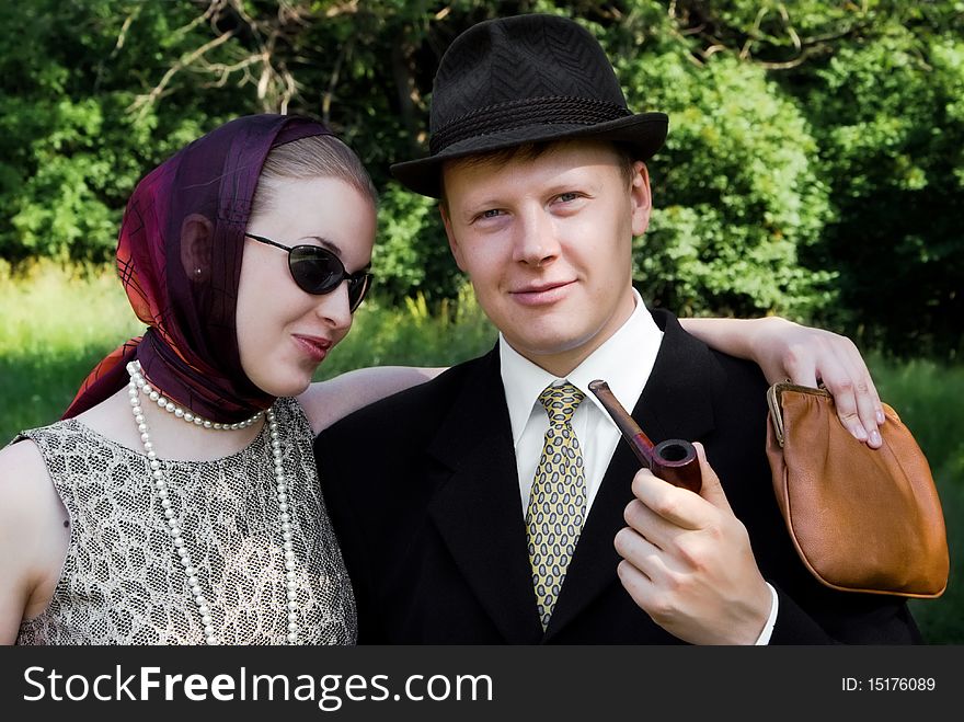 Beautiful girl and young man on a  green wood backgrounds. Beautiful girl and young man on a  green wood backgrounds