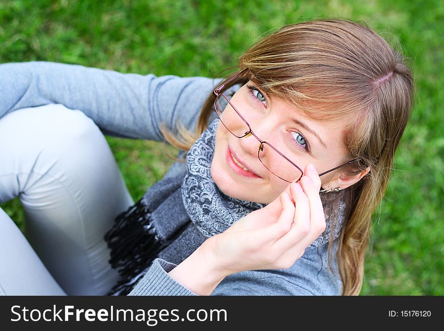 The person of the young girl in glasses. outdoors
